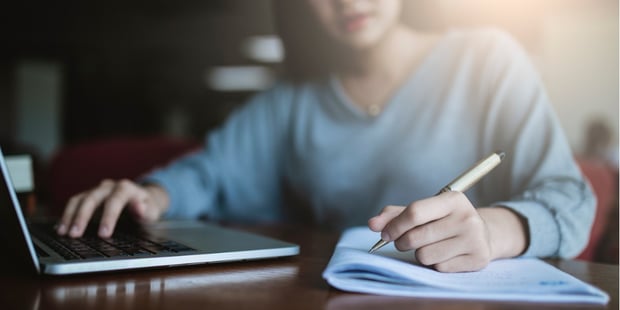 young-asia-student-study-in-the-public-library-she-making-note-on-picture-id1134467673